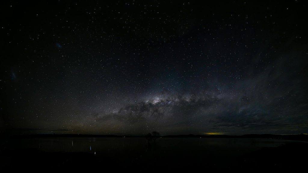 Vast starry night sky with the Milky Way galaxy shimmering in full view.